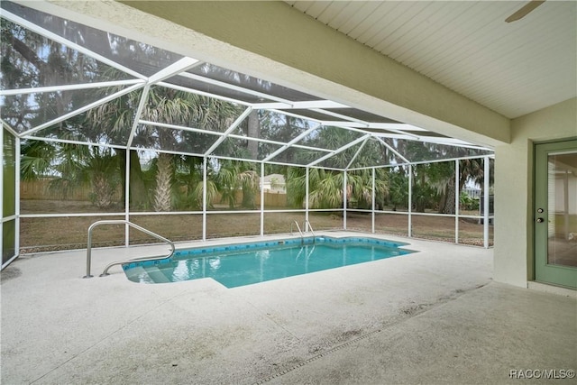 view of pool with a lanai and a patio area