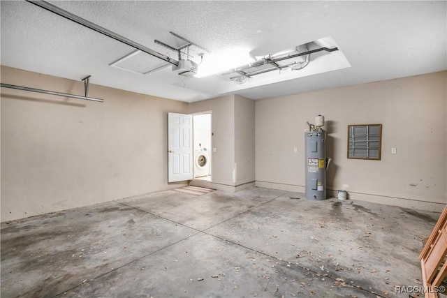 garage with a garage door opener, washer / clothes dryer, and electric water heater