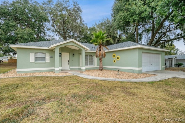 single story home with a front yard and a garage