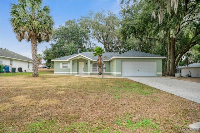 single story home featuring a garage and a front lawn