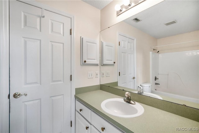 full bathroom featuring shower / bathtub combination, toilet, and vanity