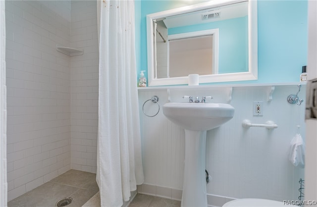 bathroom featuring a shower with curtain and tile patterned floors