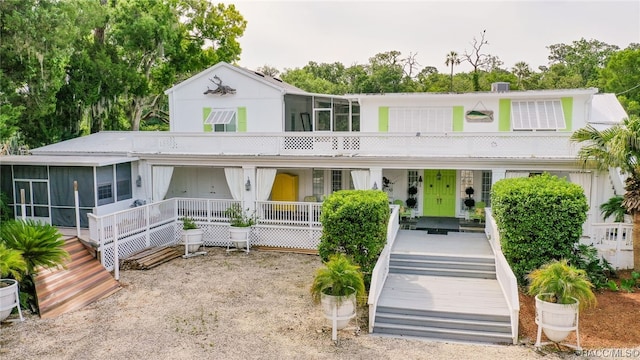 view of front of property with a sunroom