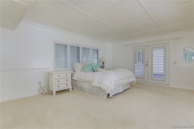 bedroom featuring light carpet, french doors, access to outside, and ornamental molding