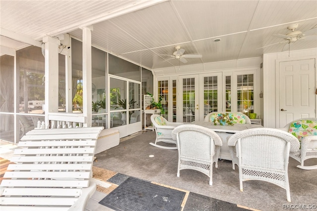 sunroom / solarium with ceiling fan and french doors