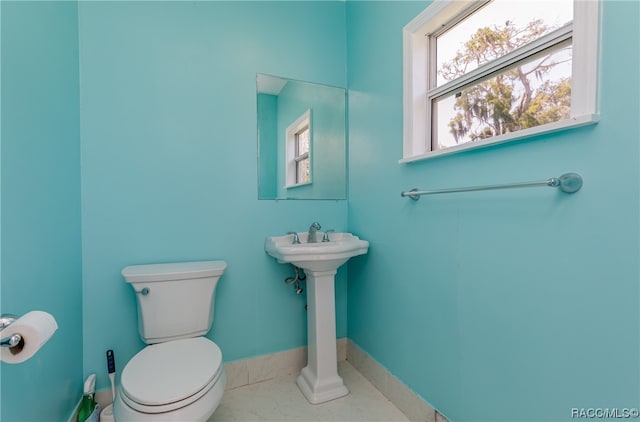 bathroom with tile patterned floors and toilet