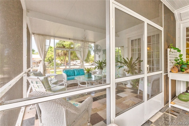 sunroom with a chandelier