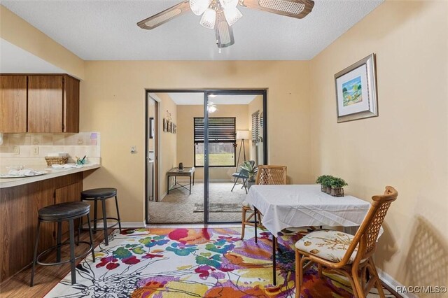 9858 N Cortlandt Dr, Citrus Springs, FL 34434 - dining area with light wood-type flooring and a ceiling fan