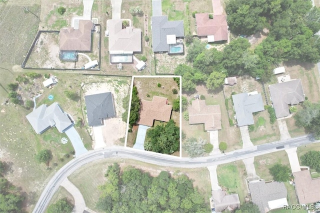 9858 N Cortlandt Dr, Citrus Springs, FL 34434 - aerial view of property's location with property boundaries highlighted and nearby suburban area