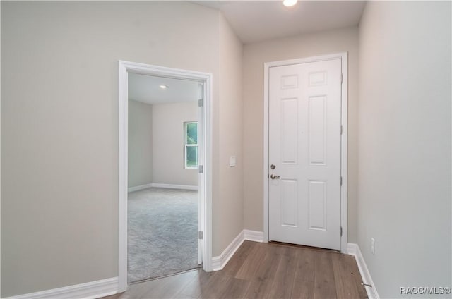 hall with light wood-type flooring