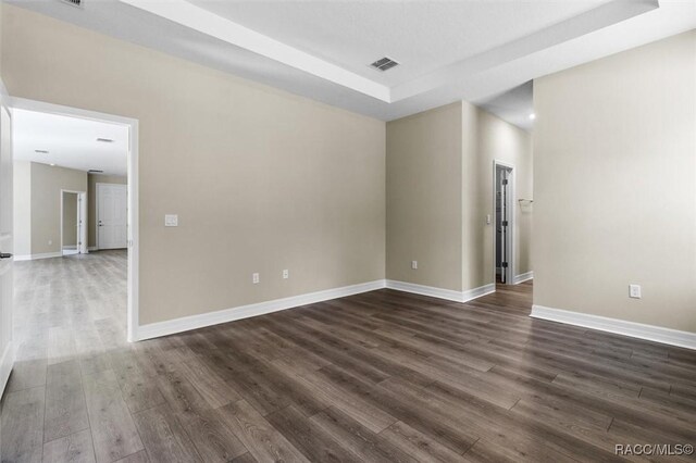 unfurnished bedroom featuring light colored carpet and a closet