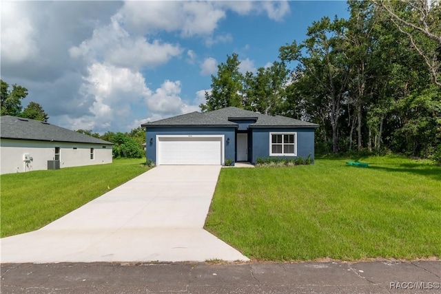 view of front of home featuring central AC unit, a garage, and a front lawn