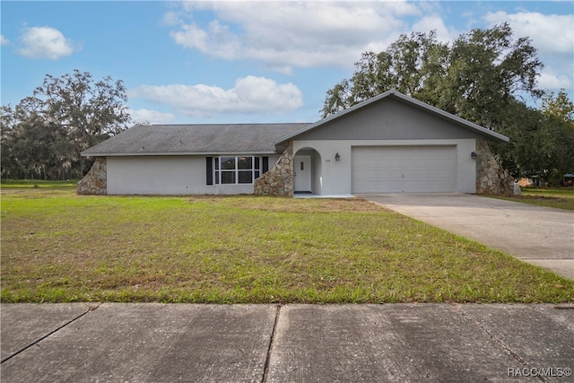 ranch-style house with a garage and a front lawn