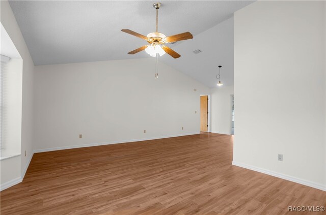 unfurnished living room featuring ceiling fan, wood-type flooring, and lofted ceiling