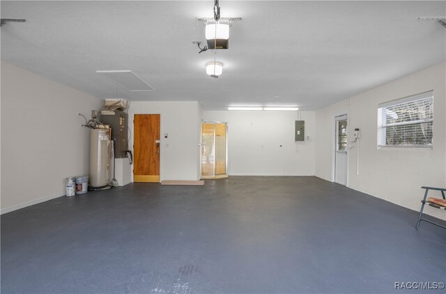 garage with electric panel, a garage door opener, and water heater