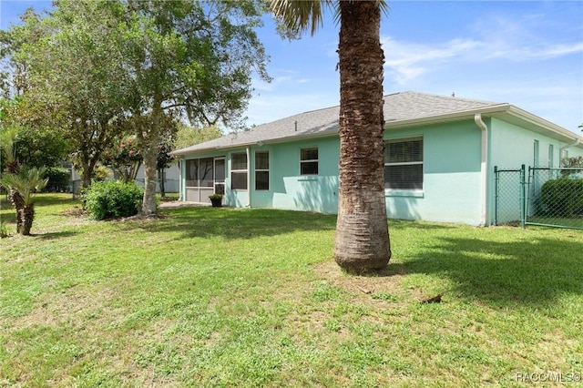 3570 E Cove Park Trl, Hernando, FL 34442 - rear view of house with a sunroom and stucco siding