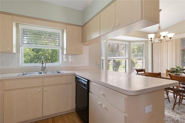 3570 E Cove Park Trl, Hernando, FL 34442 - kitchen featuring black dishwasher, a sink, a peninsula, a chandelier, and healthy amount of natural light