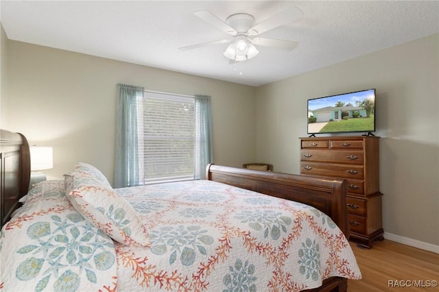 3570 E Cove Park Trl, Hernando, FL 34442 - bedroom with light wood-style floors, baseboards, and ceiling fan