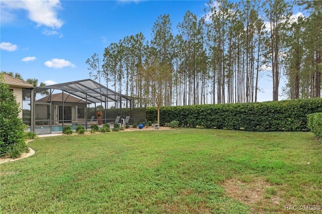 view of yard featuring a lanai and an outdoor pool