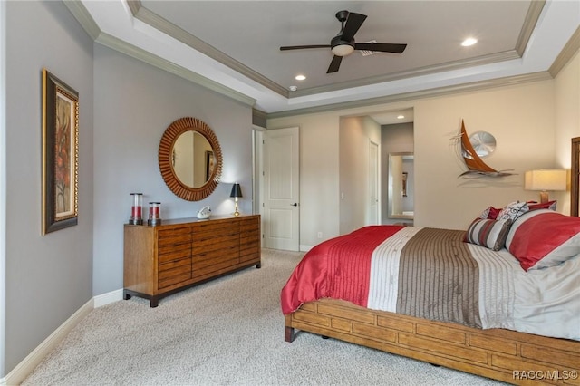 bedroom with light carpet, a raised ceiling, ceiling fan, and ornamental molding