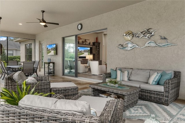 interior space with ceiling fan and plenty of natural light