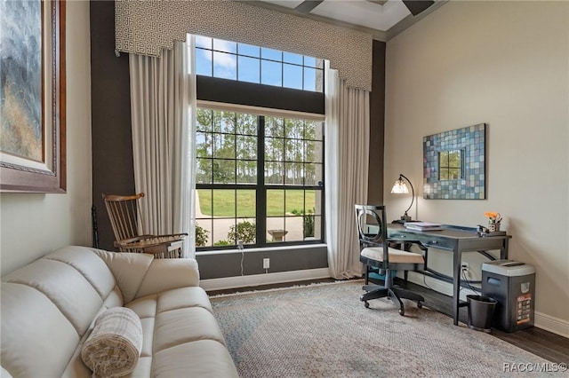 home office with hardwood / wood-style floors, ceiling fan, and a healthy amount of sunlight