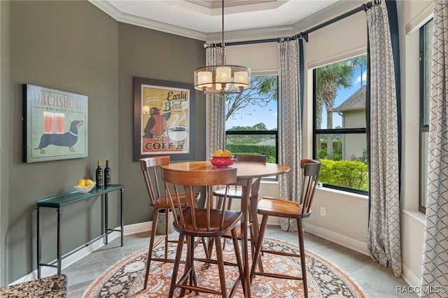 dining area featuring a chandelier, crown molding, baseboards, and light tile patterned floors