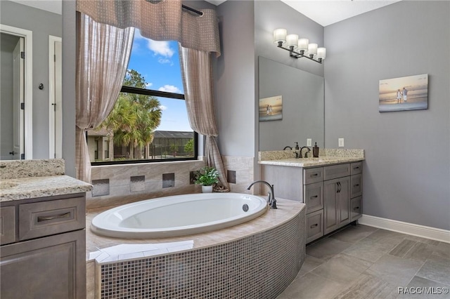 bathroom with vanity and tiled bath