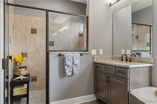 bathroom featuring vanity and a shower with door