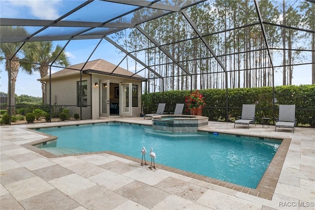 view of pool with a lanai, an in ground hot tub, and a patio