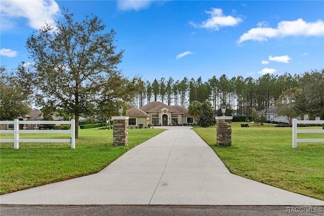 view of front of home with a front lawn