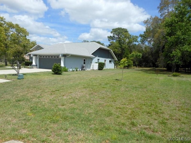 141 W Forest Oak Pl, Beverly Hills, FL 34465 - view of home's exterior featuring stucco siding, roof with shingles, driveway, a garage, and a lawn