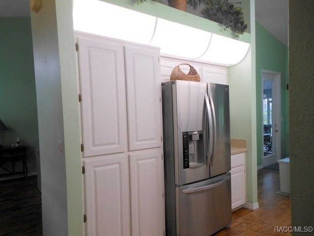 141 W Forest Oak Pl, Beverly Hills, FL 34465 - kitchen featuring stainless steel fridge with ice dispenser, white cabinetry, wood finished floors, and light countertops