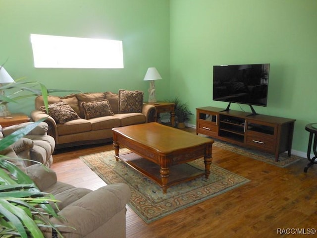 141 W Forest Oak Pl, Beverly Hills, FL 34465 - living room featuring baseboards and wood finished floors