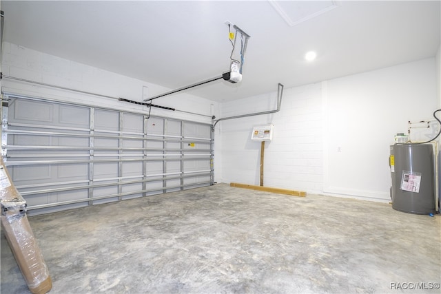 garage with electric water heater and a garage door opener