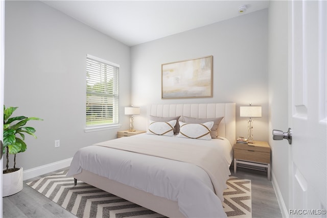 bedroom with light hardwood / wood-style floors