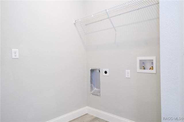 laundry room featuring hookup for an electric dryer, wood-type flooring, and washer hookup