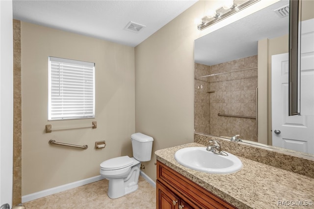 bathroom with tile patterned floors, vanity, and toilet