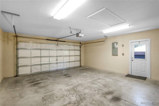 garage featuring a garage door opener and electric panel