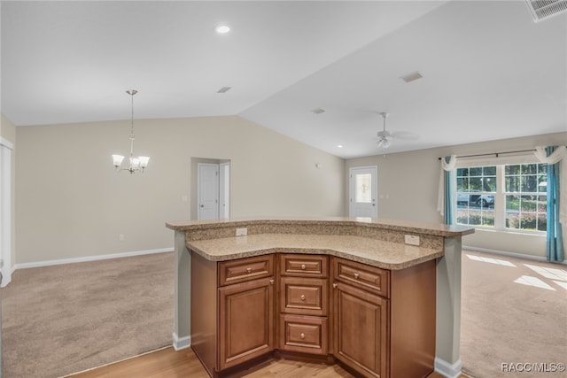 kitchen with light carpet, ceiling fan with notable chandelier, decorative light fixtures, and lofted ceiling