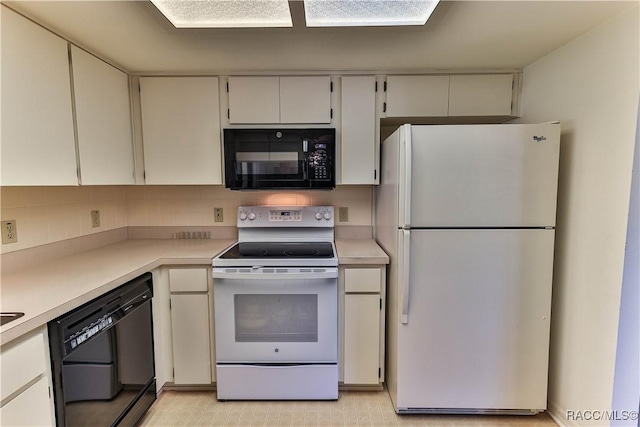5618 W Hesse Ct, Homosassa, FL 34448 - kitchen with black appliances, backsplash, and light countertops