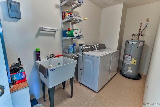 5618 W Hesse Ct, Homosassa, FL 34448 - clothes washing area featuring laundry area, washing machine and dryer, light floors, and electric water heater
