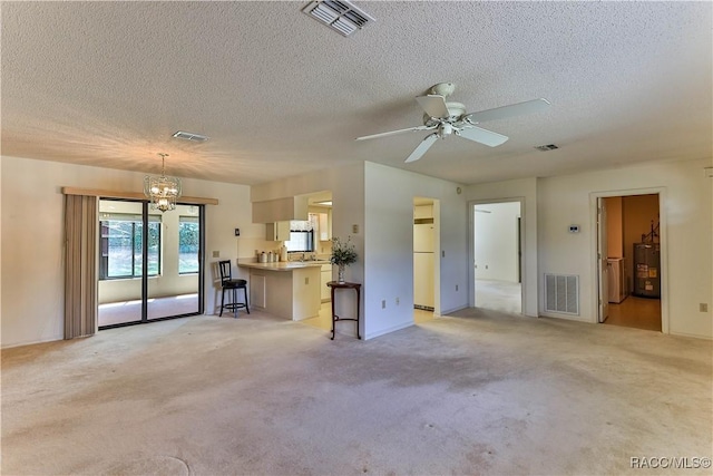 5618 W Hesse Ct, Homosassa, FL 34448 - unfurnished living room with water heater, visible vents, and light colored carpet