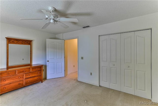 5618 W Hesse Ct, Homosassa, FL 34448 - unfurnished bedroom with carpet, a closet, visible vents, ceiling fan, and a textured ceiling