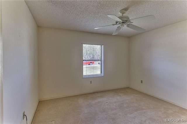 5618 W Hesse Ct, Homosassa, FL 34448 - unfurnished room with a textured ceiling, a ceiling fan, and light colored carpet