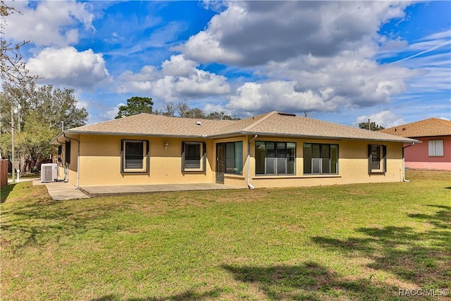 5618 W Hesse Ct, Homosassa, FL 34448 - back of property featuring a patio area, a lawn, and stucco siding