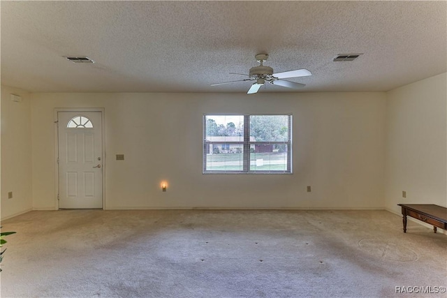 5618 W Hesse Ct, Homosassa, FL 34448 - foyer featuring light carpet, a textured ceiling, visible vents, and a ceiling fan