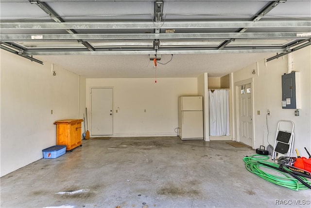 5618 W Hesse Ct, Homosassa, FL 34448 - garage with freestanding refrigerator, electric panel, and heating unit
