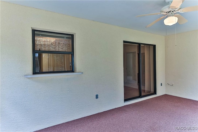 5618 W Hesse Ct, Homosassa, FL 34448 - carpeted empty room with a textured wall and ceiling fan