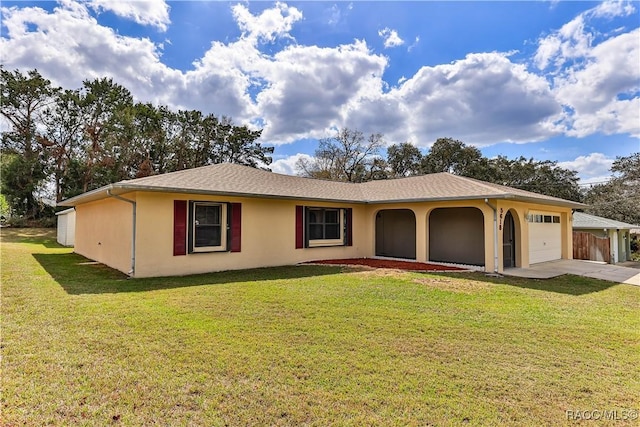 ranch-style house featuring an attached garage, driveway, a front lawn, and stucco siding